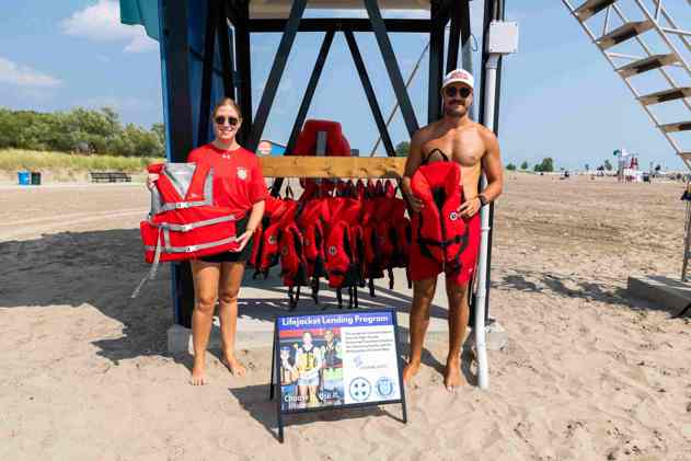 Lifeguards standing with lifejackets at Port Stanley Main Beach